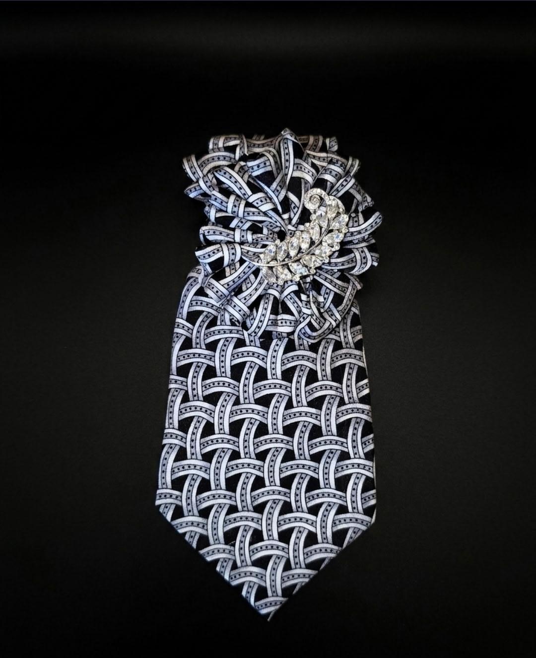 Black and white Tied in Power neckpiece with crystal leaf